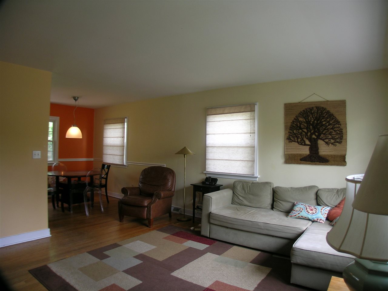 1244 Holmes Avenue Charlottesville, VA 22901 - Photo 5 of 19 a living room with furniture a dining table and chair with wooden floor