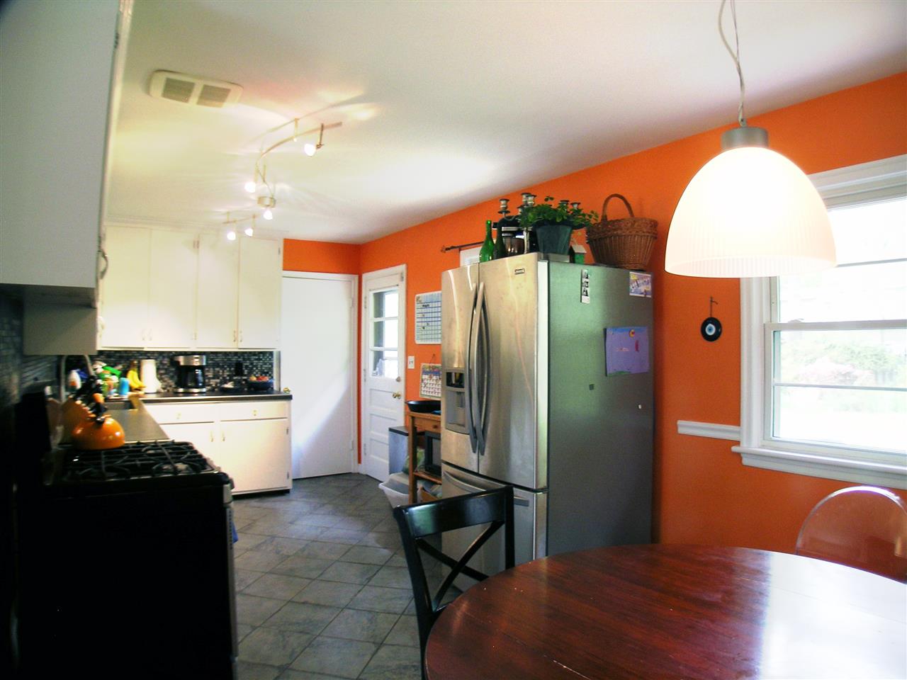 1244 Holmes Avenue Charlottesville, VA 22901 - Photo 7 of 19 a kitchen with stainless steel appliances granite countertop a refrigerator and a stove top oven
