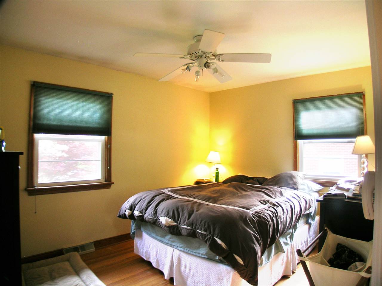 1244 Holmes Avenue Charlottesville, VA 22901 - Photo 10 of 19 a bedroom with a bed and a chandelier