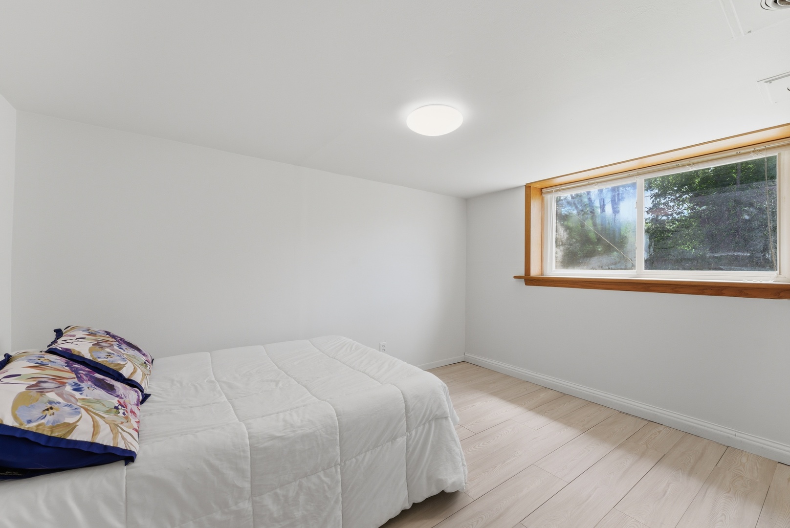 2405 31st Street Moline, IL 61265 - Photo 20 of 24 a bedroom with a bed and a painting on the wall