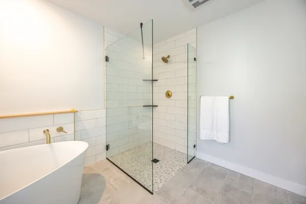 a dining room with furniture a rug and wooden floor