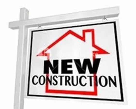 a bathroom with a potted plant and cabinets