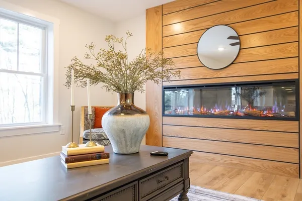 a view of hallway with wooden floor and staircase