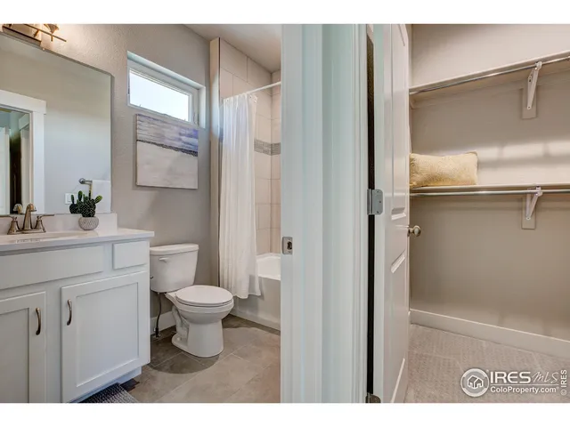 a front view of a house with outdoor seating