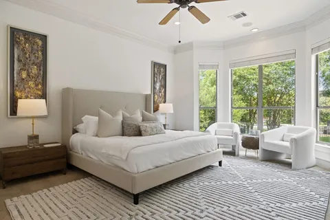 a bedroom with double bed and a window