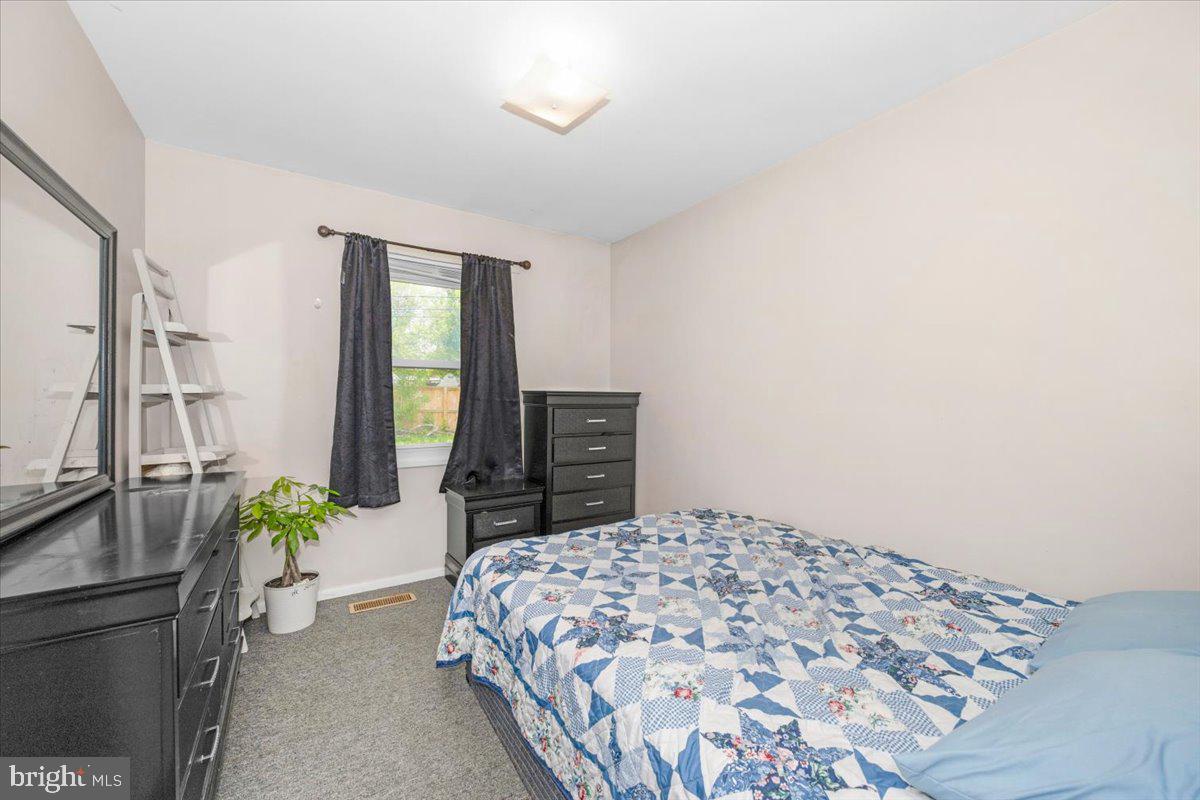 302 Manor Court Frederick, MD 21701 - Photo 18 of 33 Cozy bedroom with natural light.
