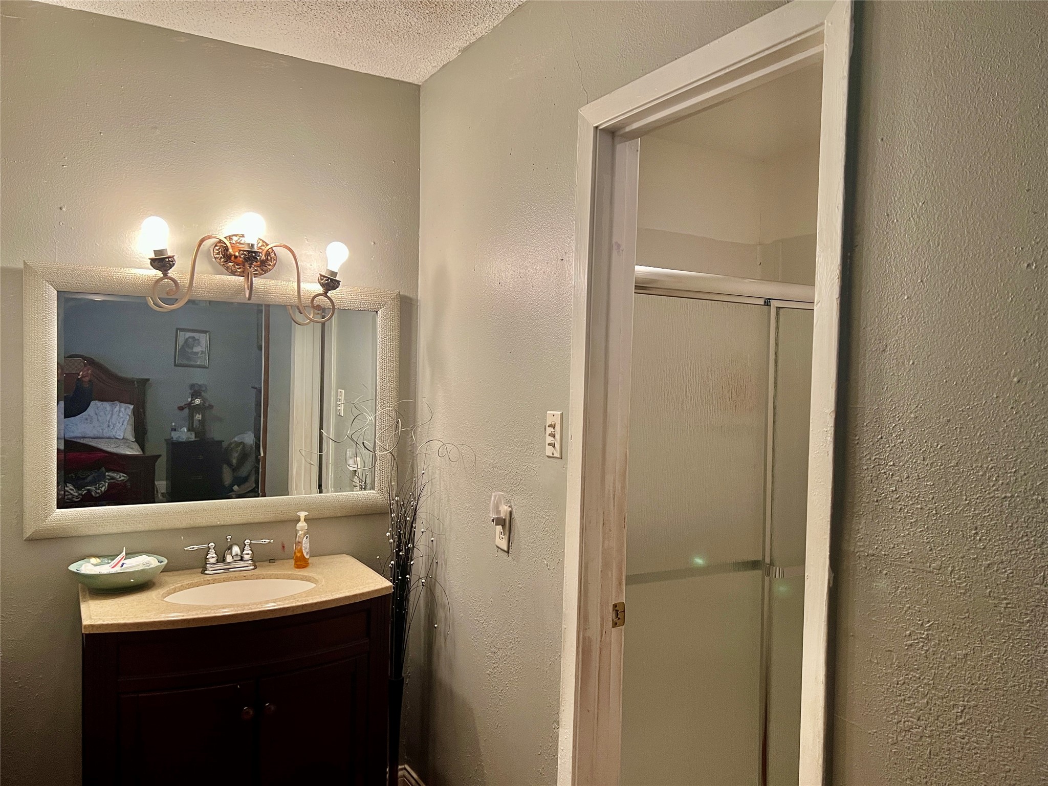 500 West 15th Street Port Arthur, TX 77640 - Photo 12 of 17 a bathroom with a sink and a mirror