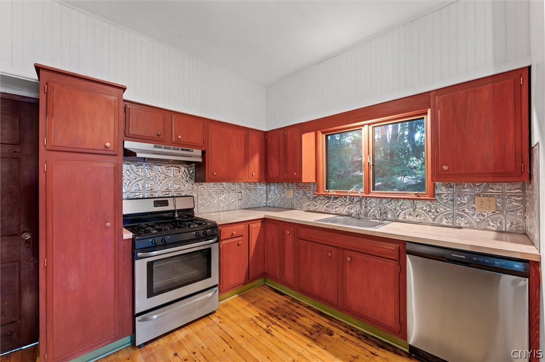 303 Barrington Road, Unit 5 Syracuse, NY 13214 - Photo 15 of 44 Stainless gas stove, range and dishwasher