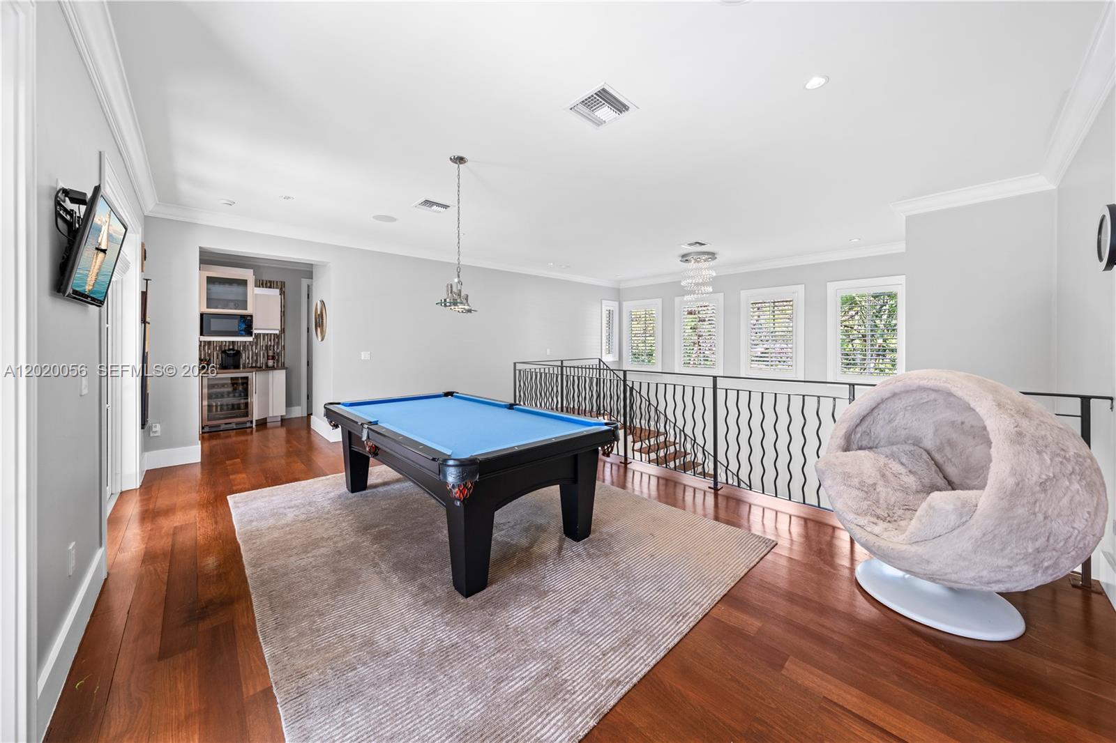 4196 Douglas Road Miami, FL 33133 - Photo 42 of 96 a living room with furniture and a wooden floor