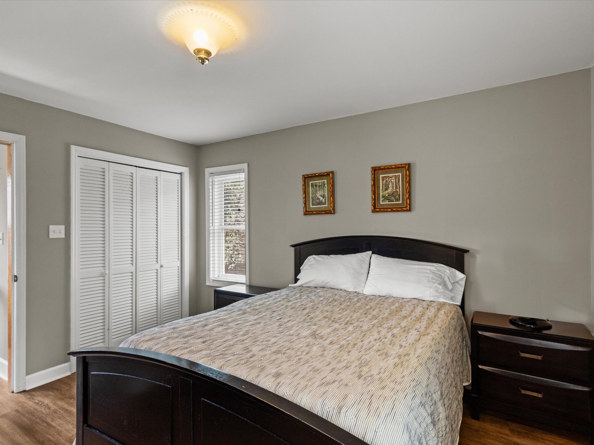 96 Maple Drive Winchester, TN 37398 - Photo 17 of 40 a bedroom with a bed and a chandelier