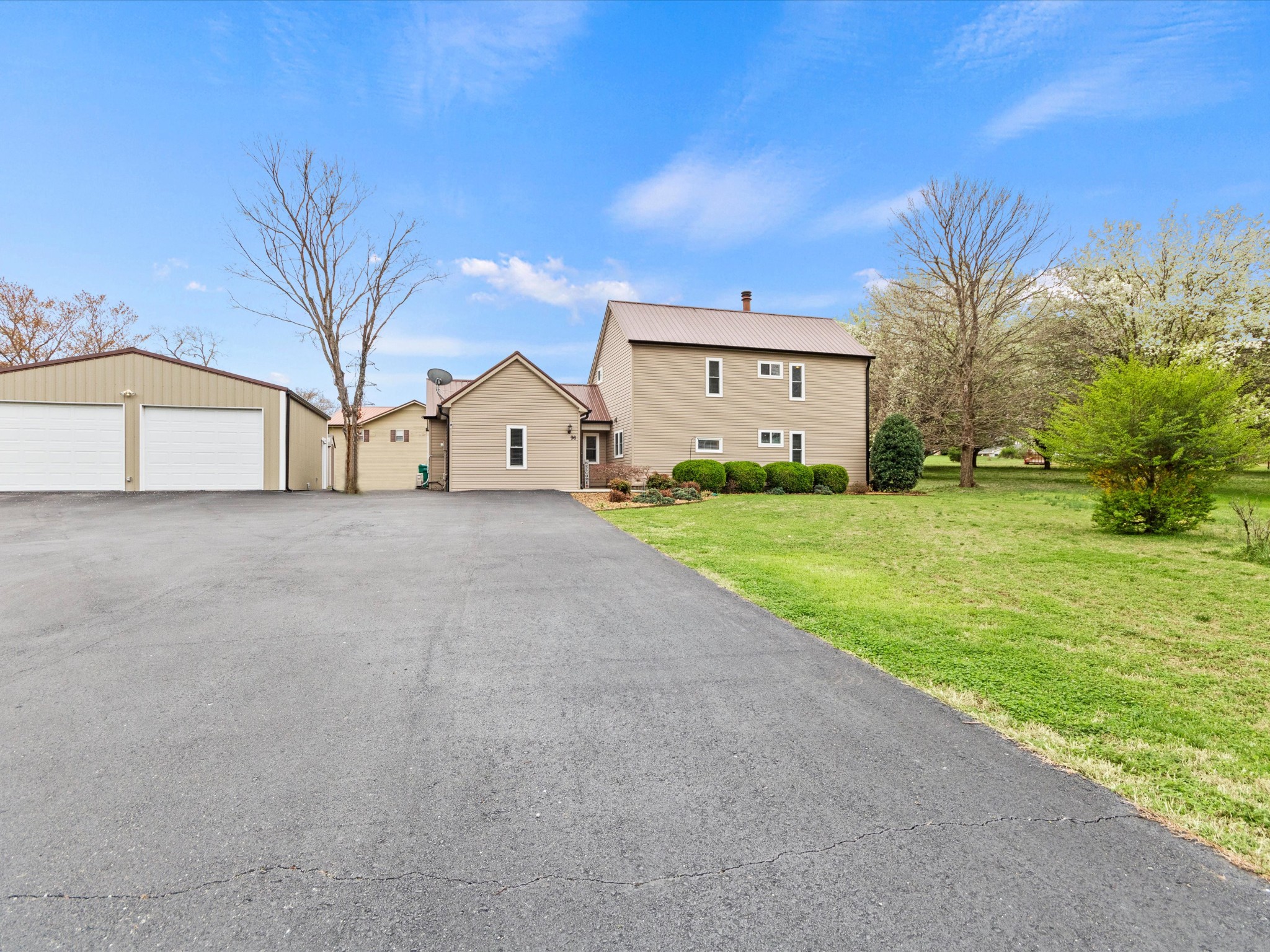 96 Maple Drive Winchester, TN 37398 - Photo 2 of 40 a view of a house with a big yard and large trees
