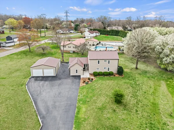 an aerial view of a house with outdoor space and mountain view