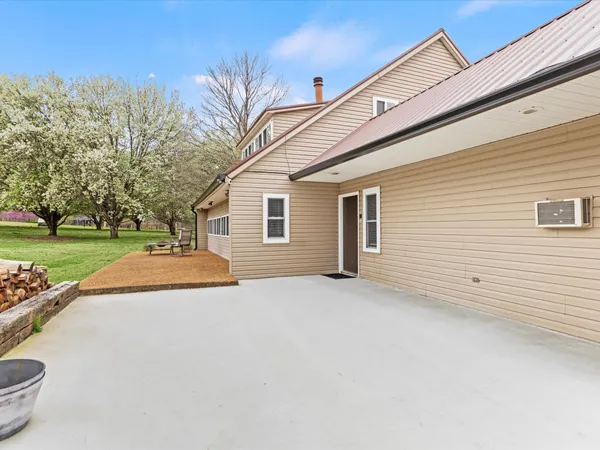 a view of a house with a yard and garage