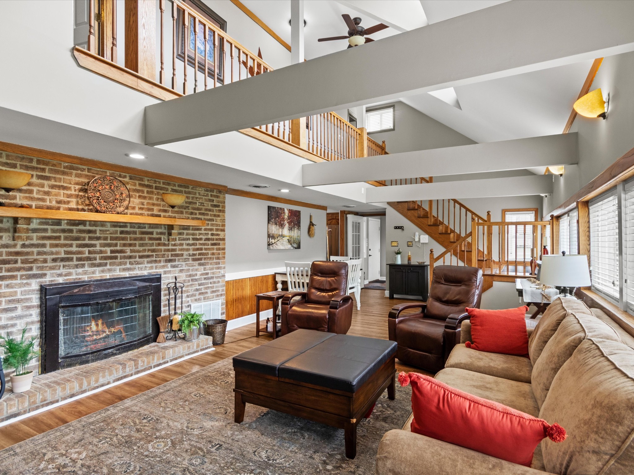 96 Maple Drive Winchester, TN 37398 - Photo 10 of 40 a living room with furniture a fireplace and a large window
