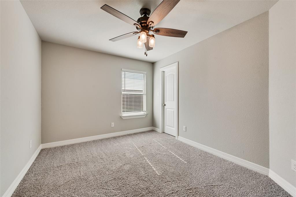 625 Copenhavr Street Pilot Point, TX 76258 - Photo 17 of 20 Carpeted spare room with baseboards and ceiling fan