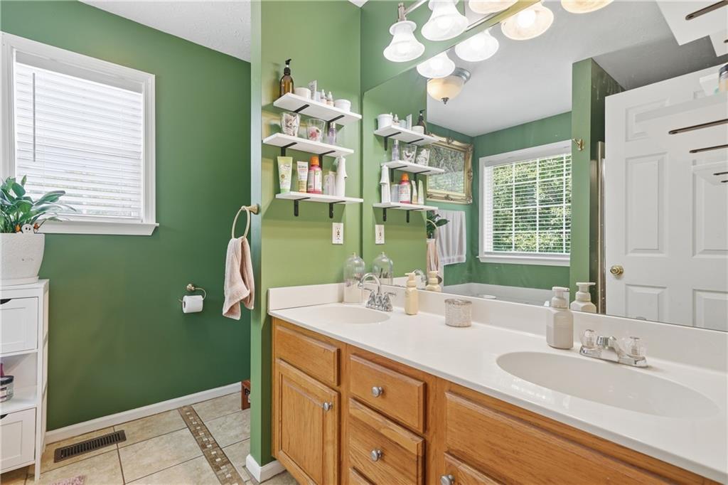 137 Orchard Way Southeast Calhoun, GA 30701 - Photo 18 of 39 a bathroom with a double vanity sink and a mirror