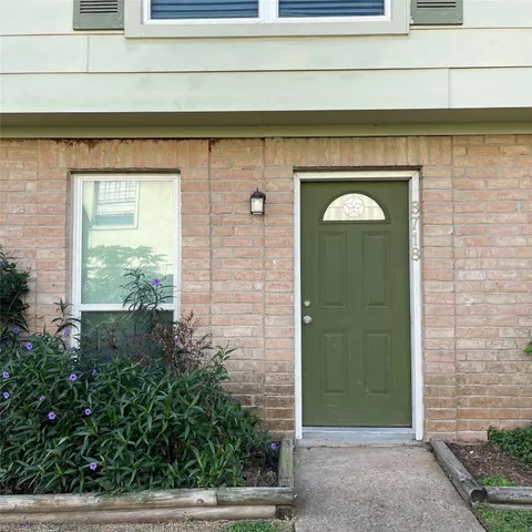 a front view of a house with a glass door