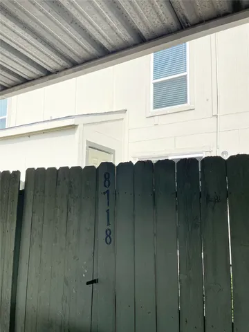 a view of a bathroom with shower and a sink