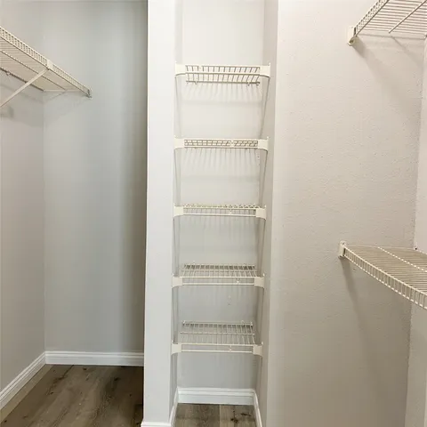 a view of a room with racks on the wall