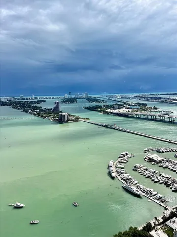 a dining room with furniture window and outside view