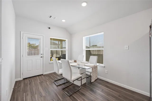 a work room with furniture and wooden floor