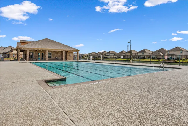 a view of a house with a yard and balcony