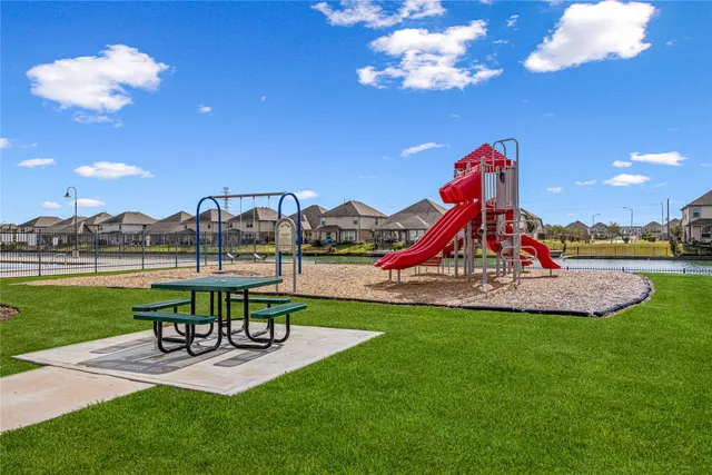 a view of a house with sitting area and slide