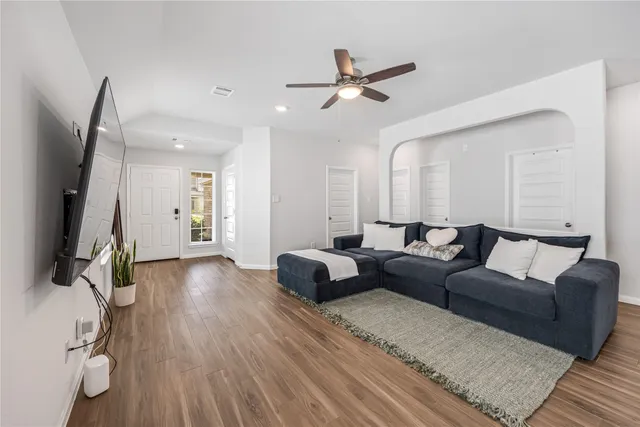 a living room with furniture and a flat screen tv