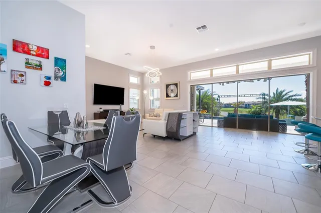 a view of a livingroom with furniture and a flat screen tv