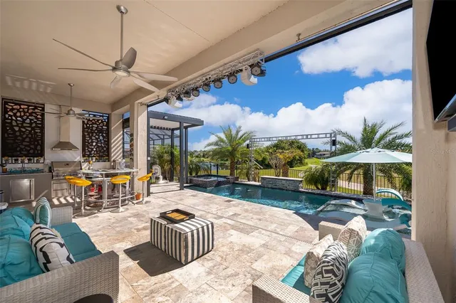 a view of a patio with a table and chairs and wooden floor
