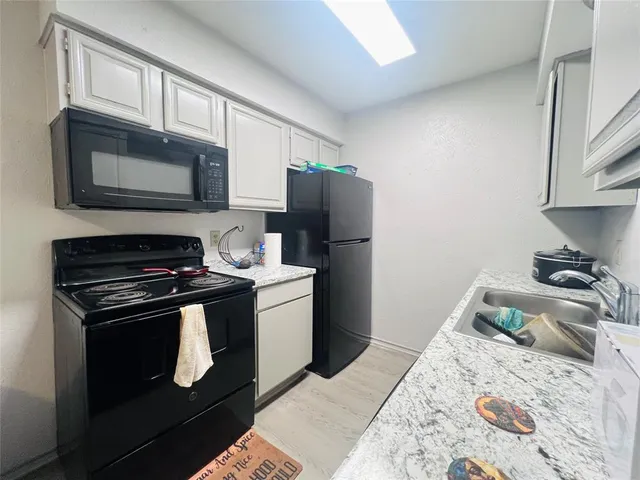 a kitchen with a stove and a microwave