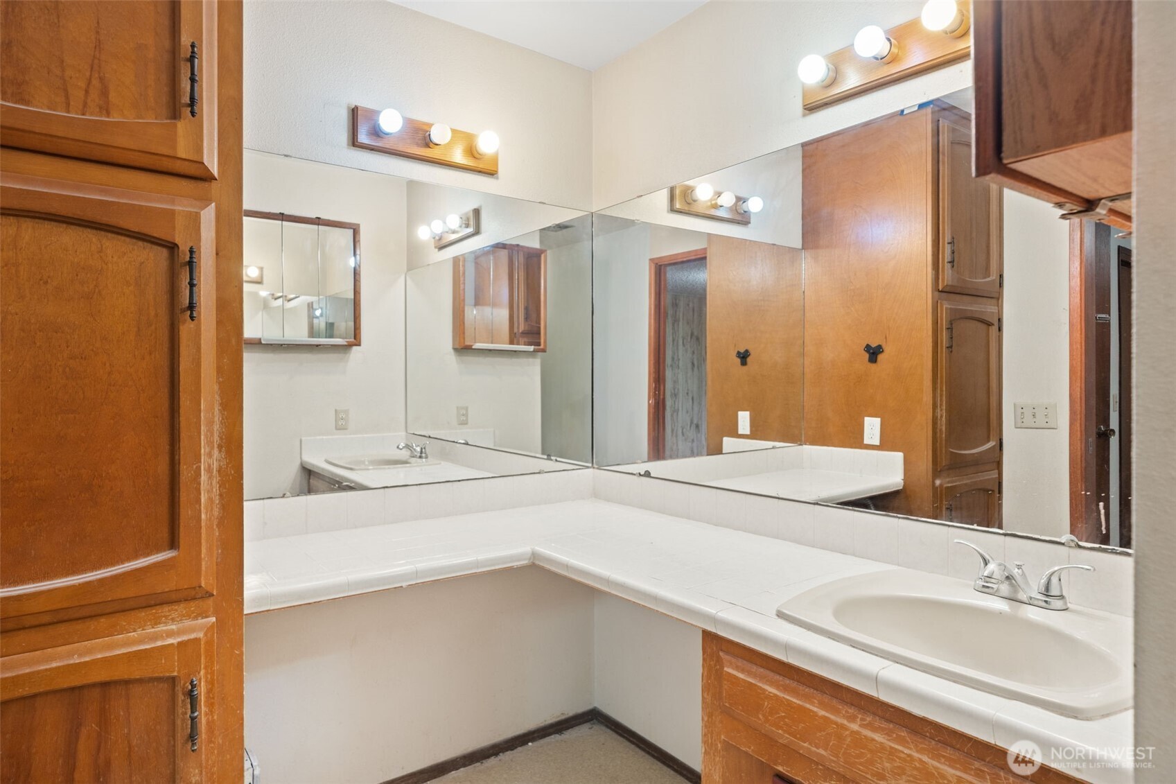 110 Marchbanks Road Sequim, WA 98382 - Photo 15 of 35 a bathroom with a sink and a mirror