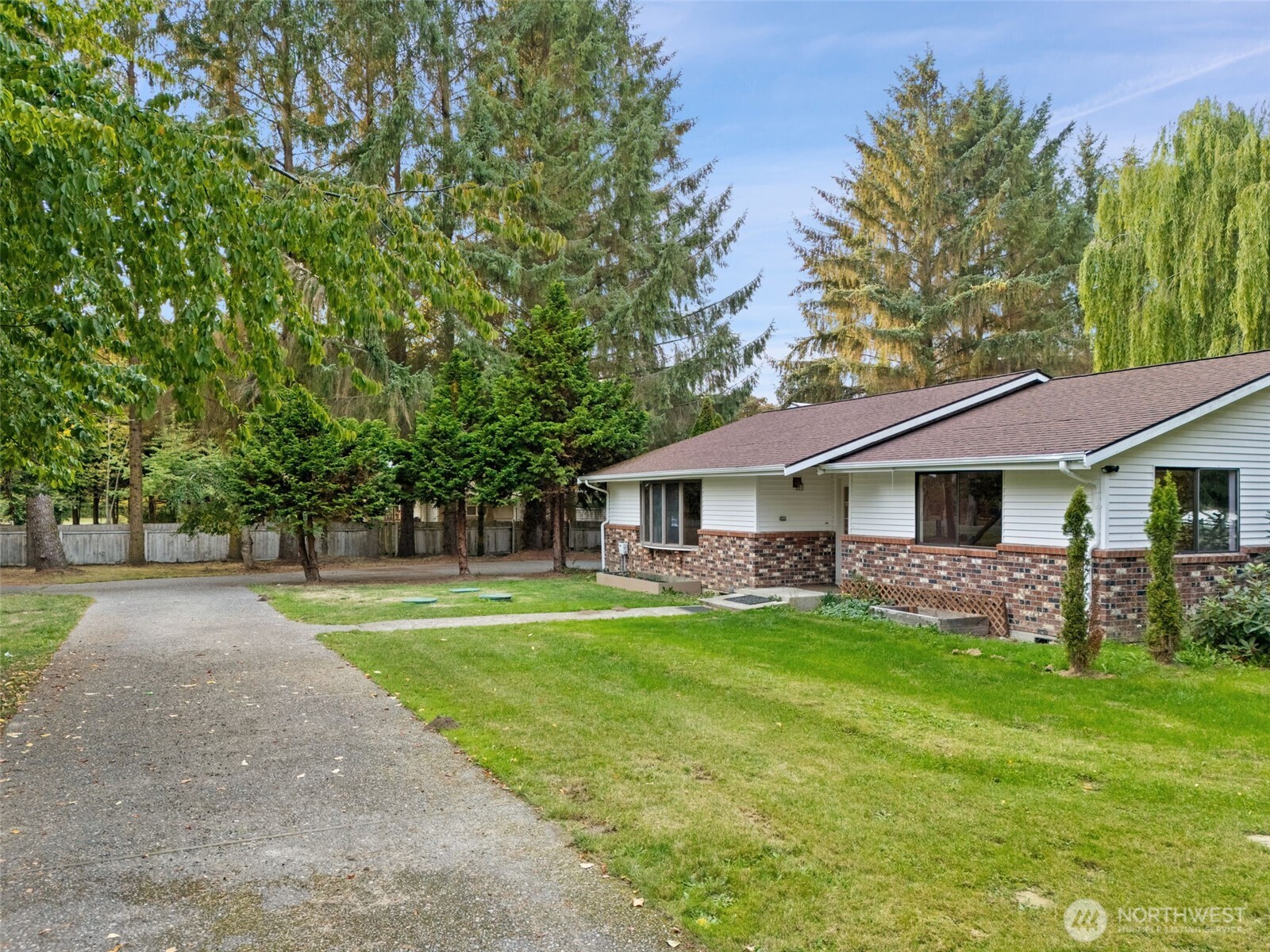 110 Marchbanks Road Sequim, WA 98382 - Photo 31 of 35 a front view of a house with a garden