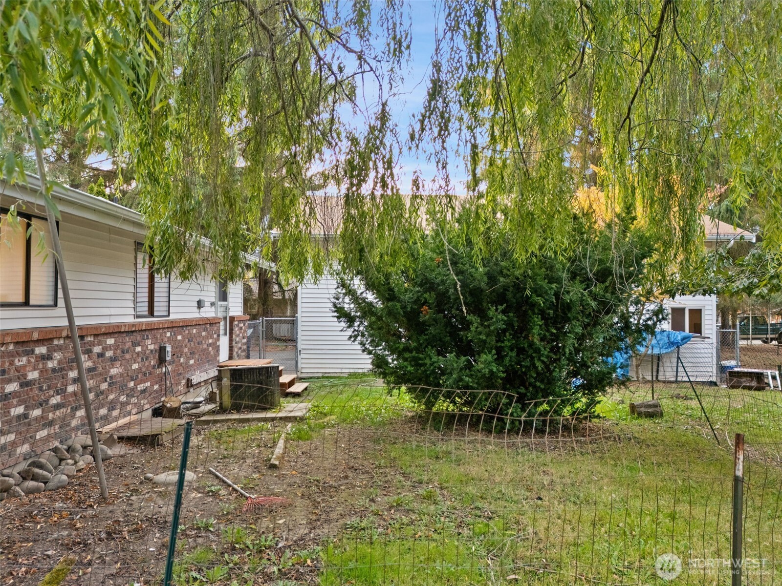 110 Marchbanks Road Sequim, WA 98382 - Photo 34 of 35 a backyard of a house with lots of green space