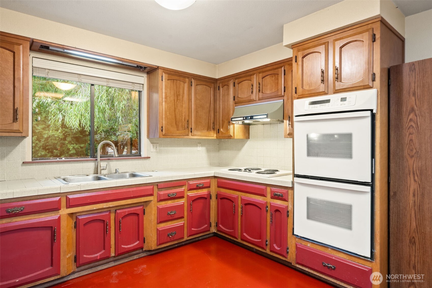 110 Marchbanks Road Sequim, WA 98382 - Photo 9 of 35 a kitchen with stainless steel appliances granite countertop a sink and dishwasher a refrigerator with wooden cabinets
