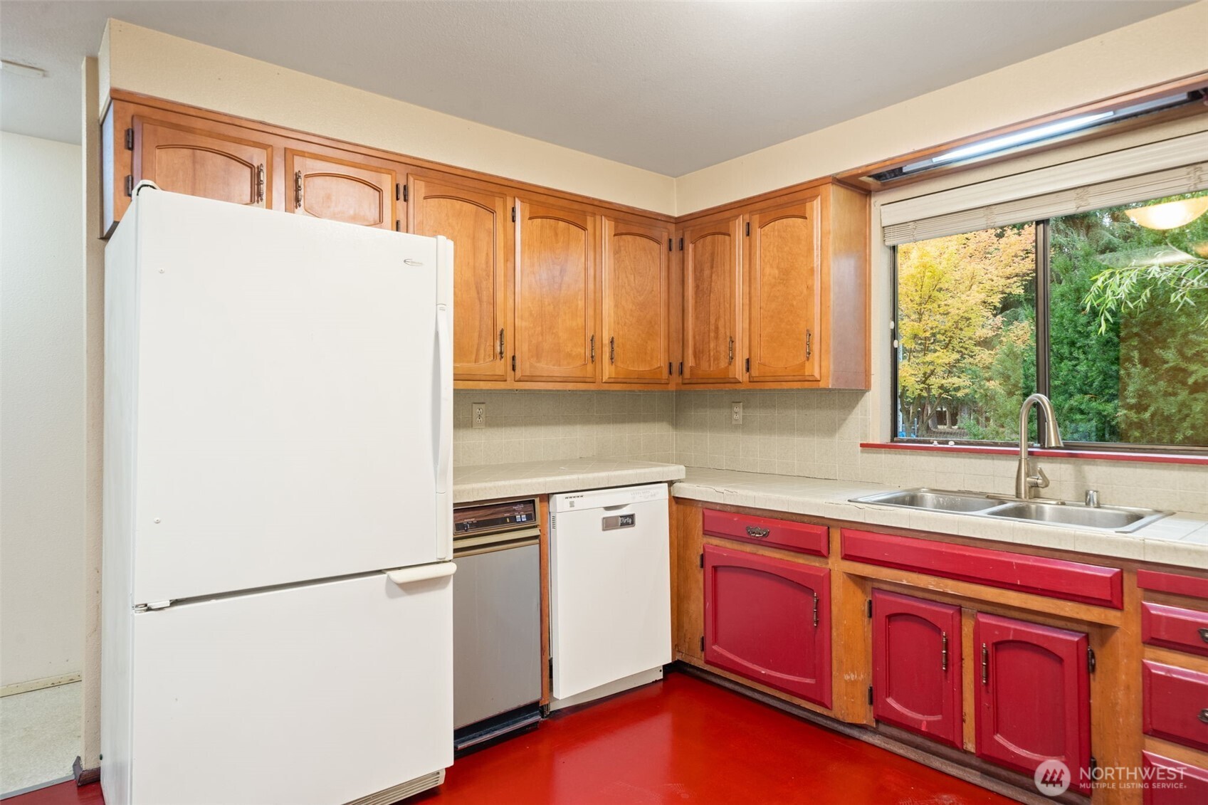 110 Marchbanks Road Sequim, WA 98382 - Photo 10 of 35 a kitchen with a refrigerator sink and cabinets