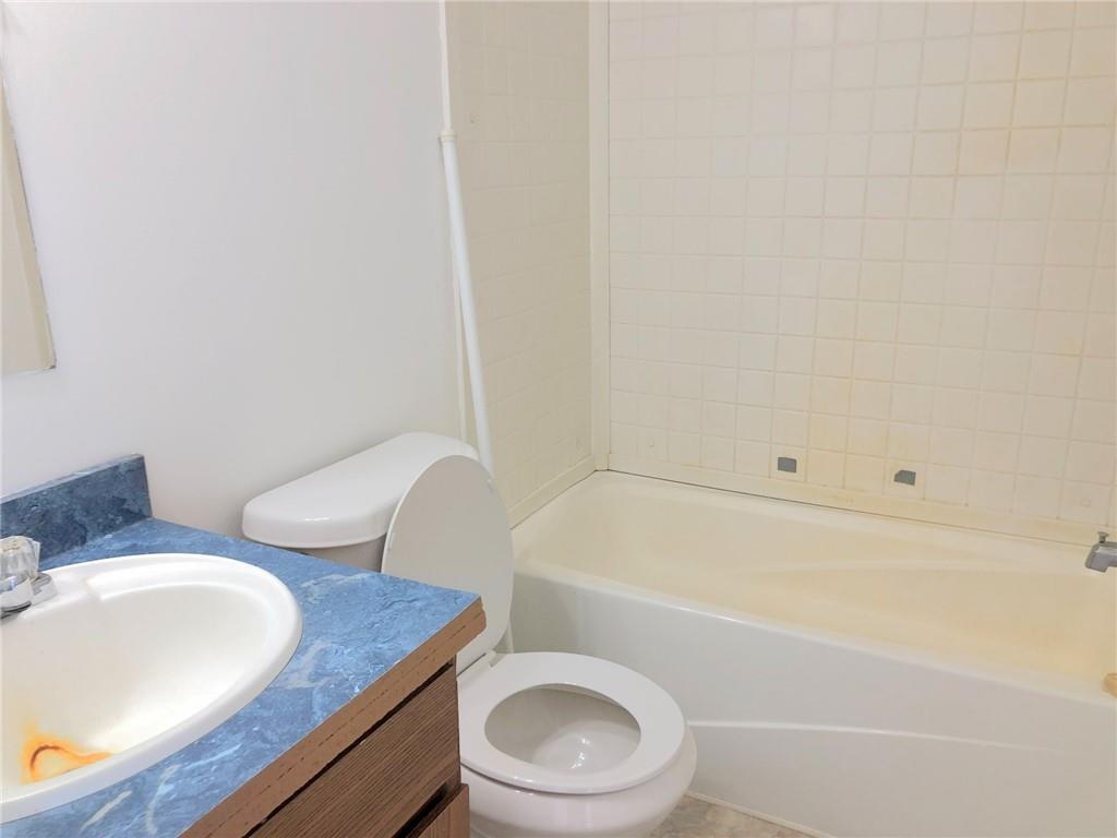 1560 Grindle Bridge Road Dahlonega, GA 30533 - Photo 13 of 21 a bathroom with a granite countertop toilet and a sink