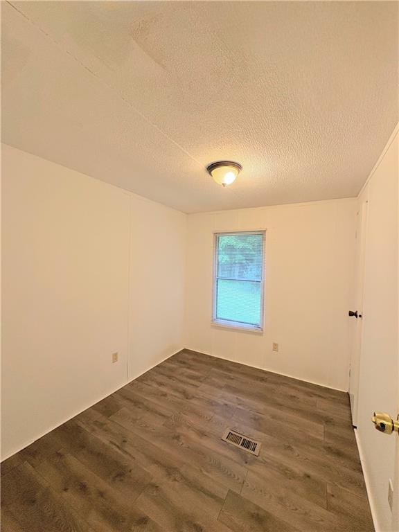1560 Grindle Bridge Road Dahlonega, GA 30533 - Photo 15 of 21 an empty room with wooden floor and windows