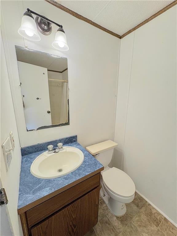 1560 Grindle Bridge Road Dahlonega, GA 30533 - Photo 17 of 21 a bathroom with a sink a toilet and mirror