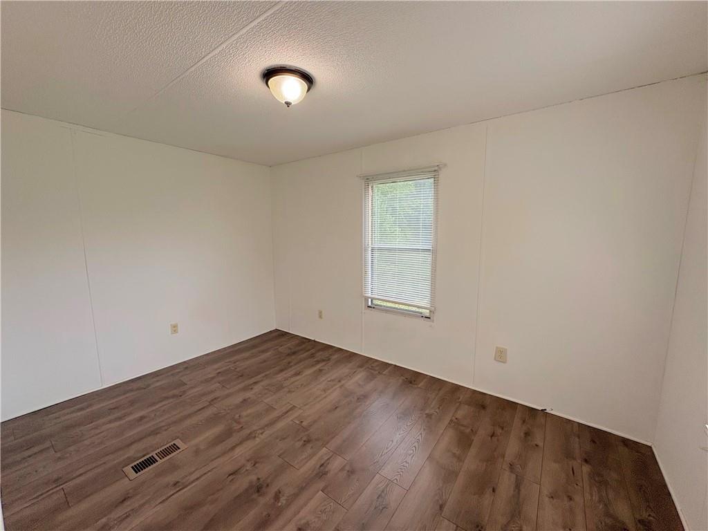 1560 Grindle Bridge Road Dahlonega, GA 30533 - Photo 20 of 21 an empty room with a window