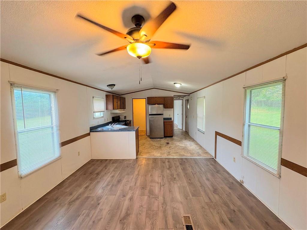 1560 Grindle Bridge Road Dahlonega, GA 30533 - Photo 4 of 21 a view of a kitchen with a wooden floor