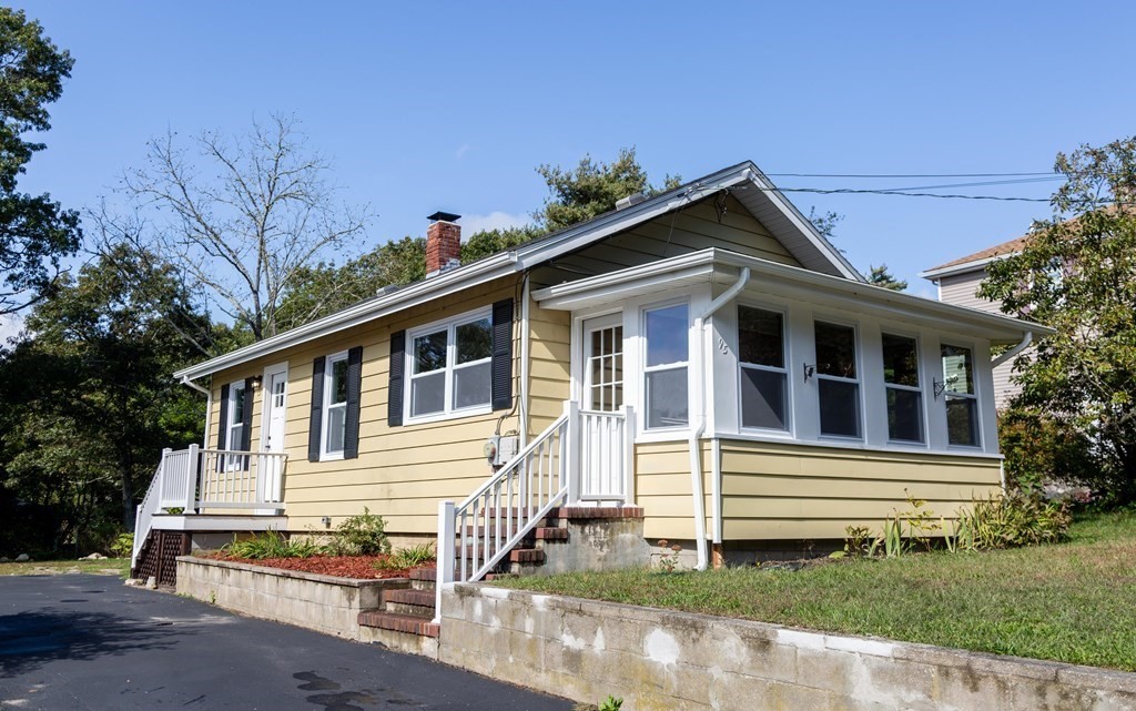 a front view of a house with a yard