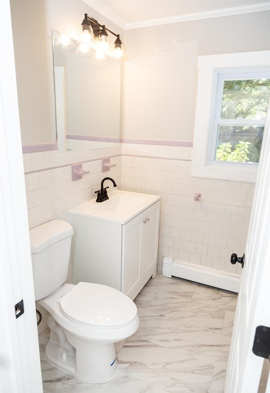 95 Wareham Road Marion, MA 02738 - Photo 3 of 14 a bathroom with a sink a toilet and a mirror
