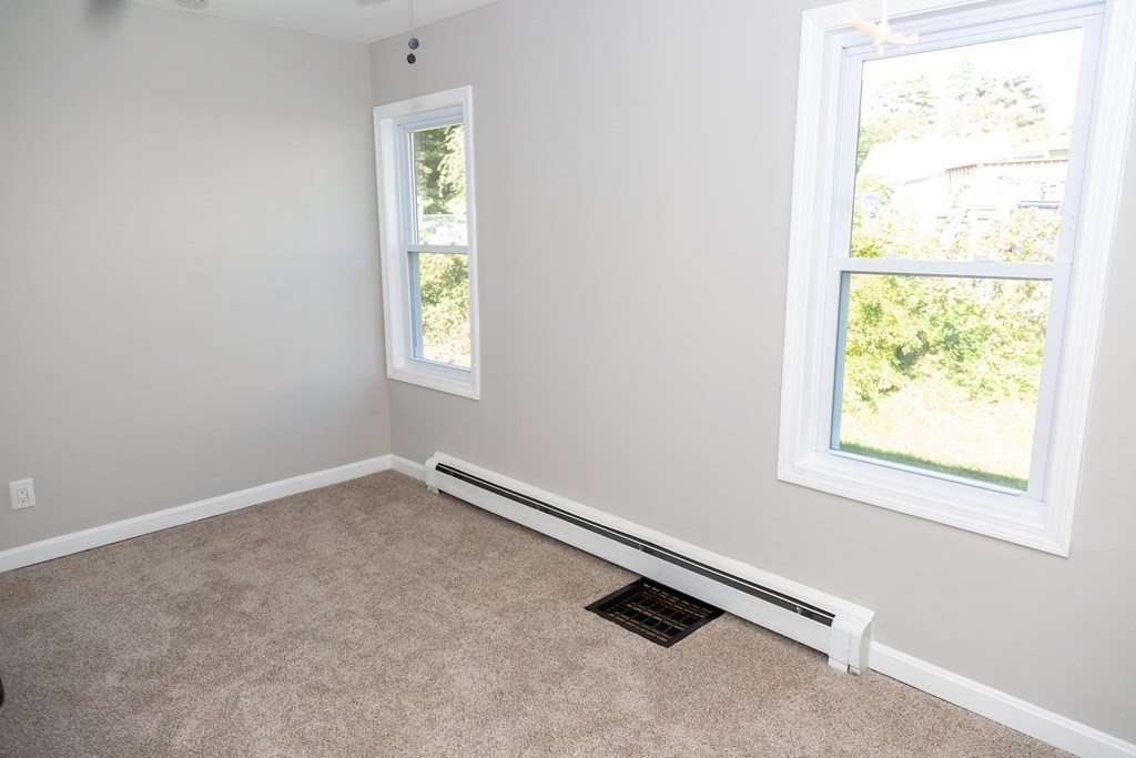 95 Wareham Road Marion, MA 02738 - Photo 6 of 14 an empty room with windows