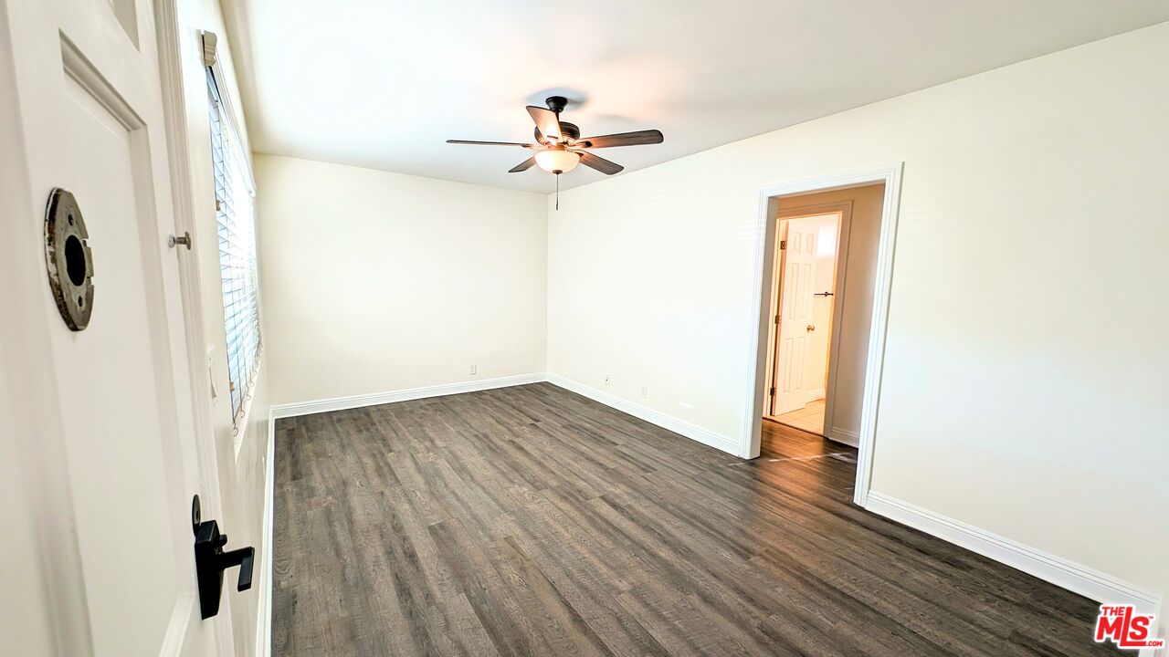 11246 Culver Boulevard Culver City, CA 90230 - Photo 4 of 13 a view of a livingroom with wooden floor and a ceiling fan