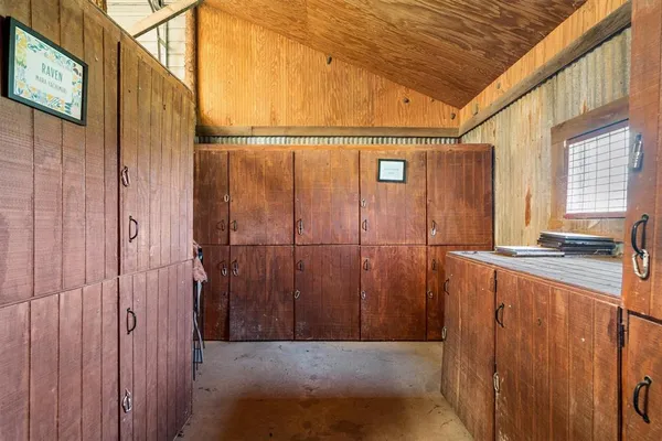 a bathroom with a shower and a sink