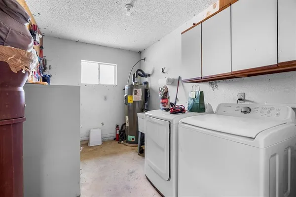 a storage room with washer and dryer