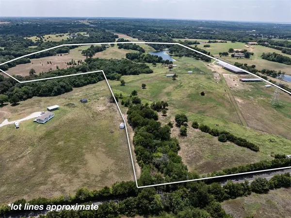 an aerial view of house with yard