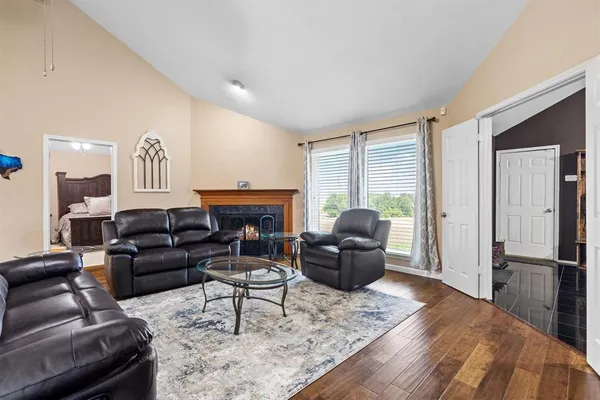 a living room with furniture windows and a fireplace