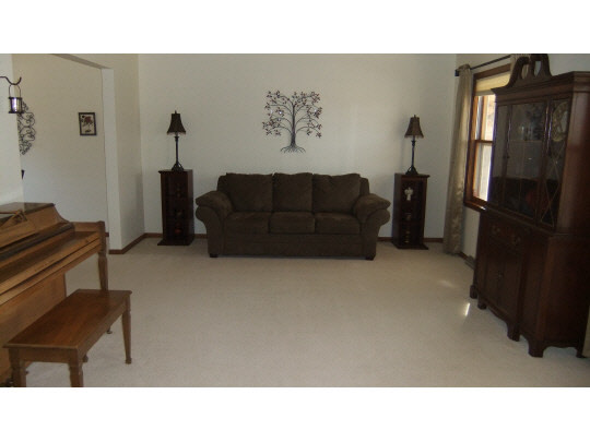 4854 Braewild Road Rockford, IL 61107 - Photo 2 of 11 a living room with furniture and a window
